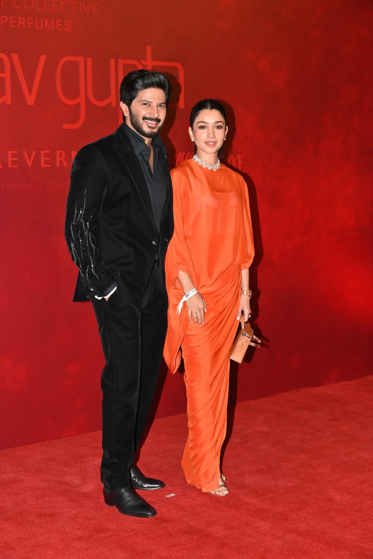 Dulquer Salmaan walked into the event with his wife Amala by his side. The actor who is known for his dapper looks opted for a black classic suit while Amala looked gorgeous in an orange drape dress